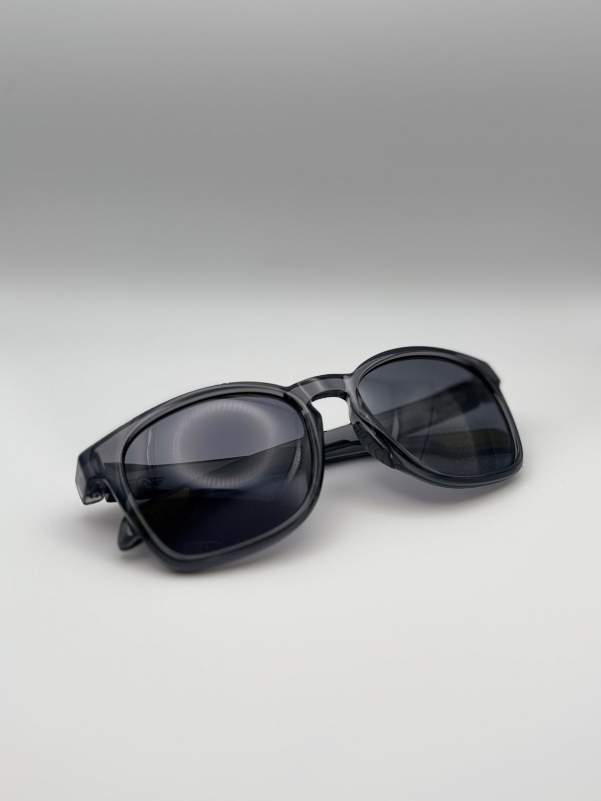Black sunglasses on a gray background
