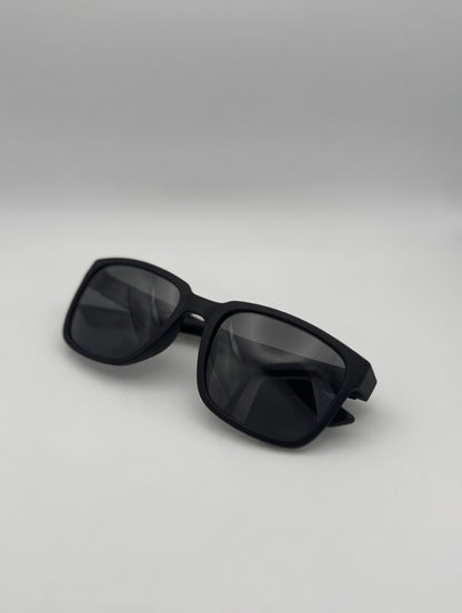 Black sunglasses on a light gray background