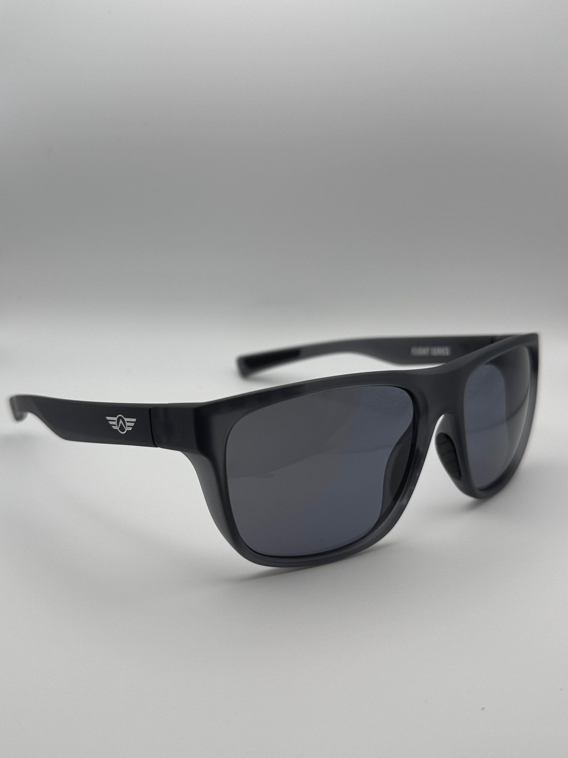Black sunglasses with a logo on a light gray background